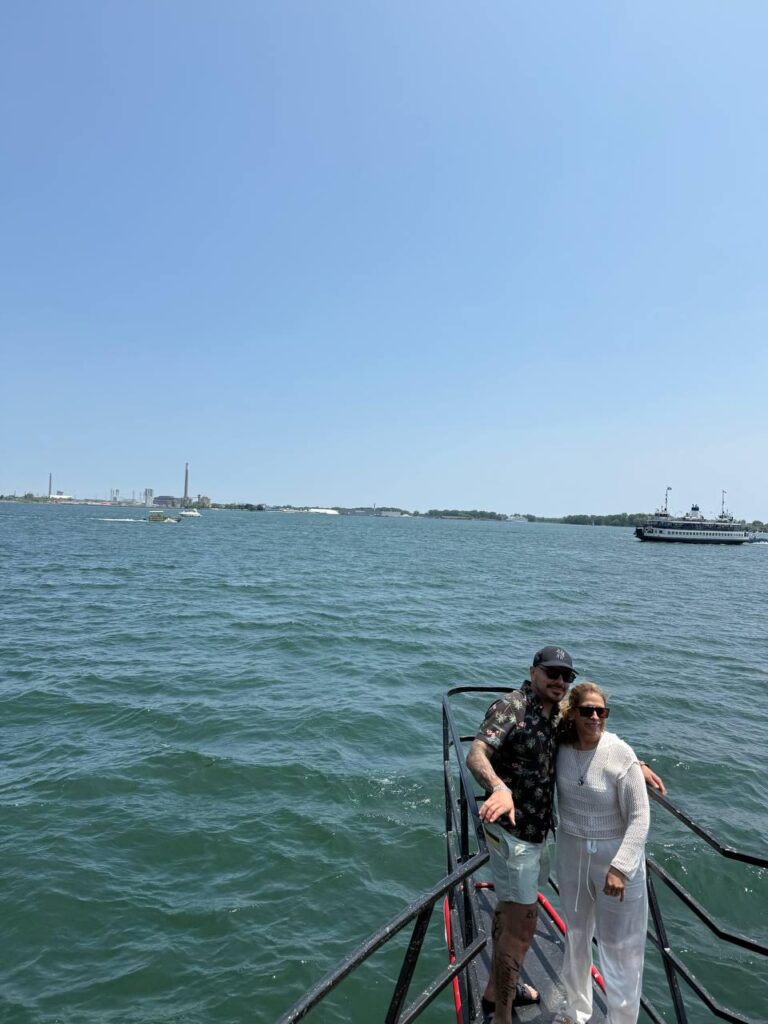 Couple beside the yacht railing