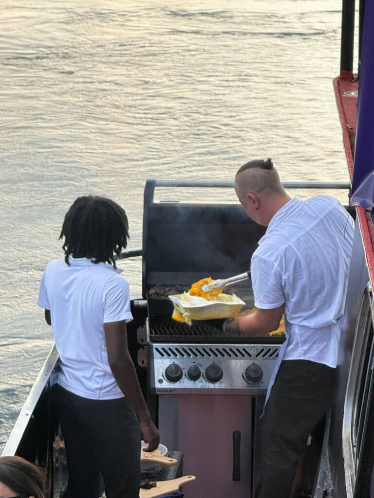 Crew member preparing food aboard