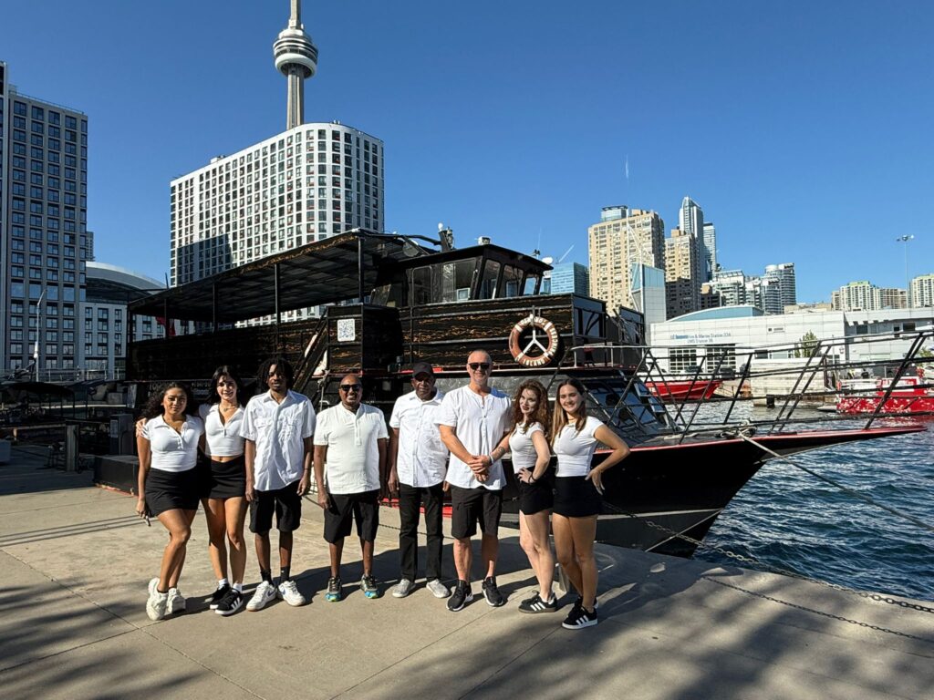 Crew standing beside Island Princess