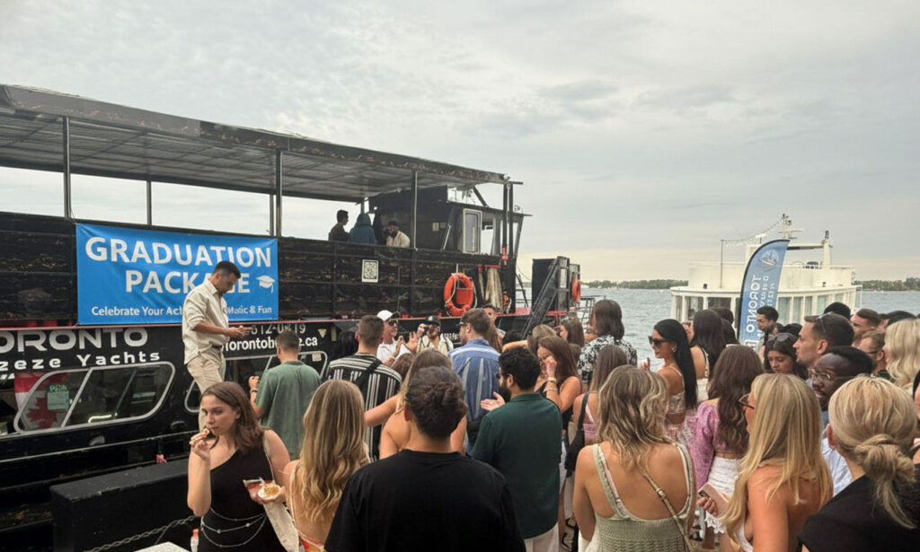 Graduation celebration beside the yacht