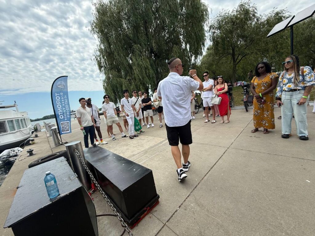 Guests walking along the waterfront